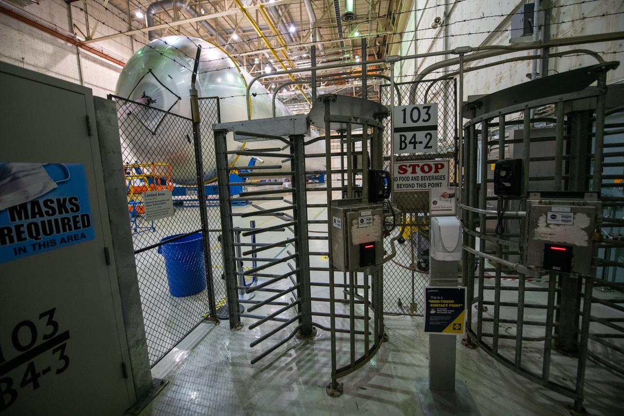 Employees wear personal protective gear at  Michoud Assembly Facility as the facility transitioned to Stage 3 of NASA’s Framework for Return To On-Site Work. Employees wear the appropriate personal protective equipment (PPE) and/or cloth face coverings as required for assigned tasks. Access to the facility is limited to authorized personnel working on mission-critical tasks that must be conducted onsite. Mission-critical tasks include slowly and methodically resuming Space Launch System (SLS) Core Stage and Orion production activities, particularly critical path deliverables to support the Artemis Program, at a pace that limits personnel and follows federal guidelines for social distancing and use of personal protective equipment such as face masks. For more information about SLS, visit nasa.gov/sls.